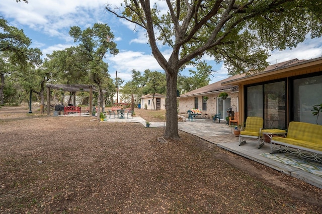 11404 Fm 1826, Austin, TX 78737 - view of yard with a patio area, a pergola, and an outdoor structure