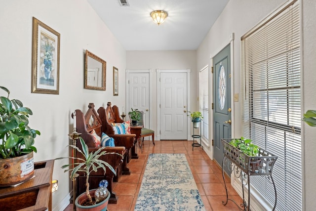 entrance foyer featuring light tile patterned floors