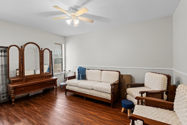 living area featuring dark hardwood / wood-style floors and ceiling fan