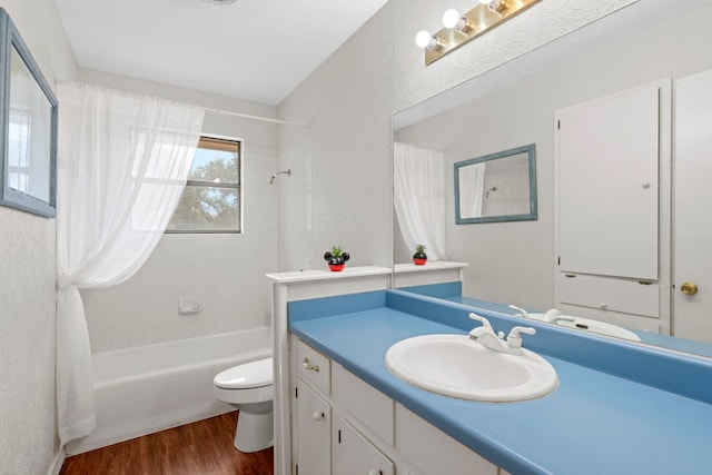 full bathroom with toilet, shower / bath combo, vanity, and hardwood / wood-style floors