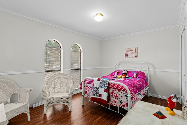 bedroom featuring dark wood-type flooring and ornamental molding