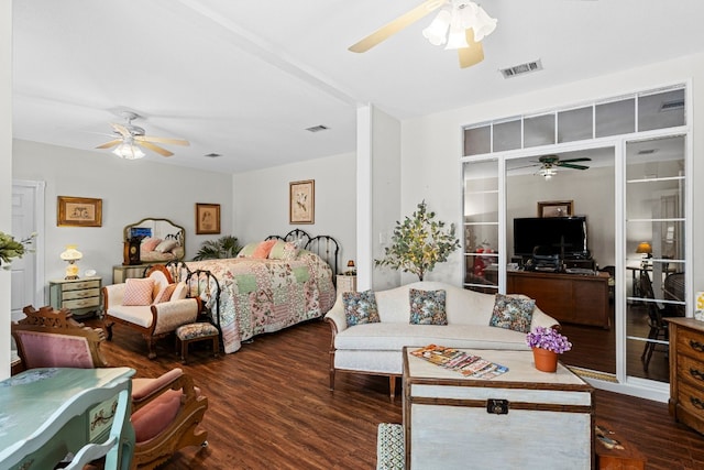 bedroom with ceiling fan and dark hardwood / wood-style flooring