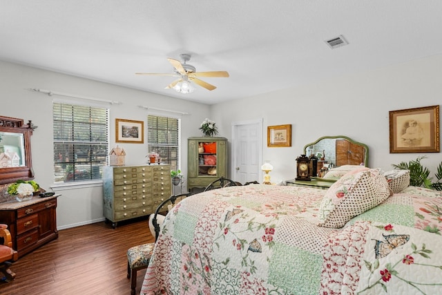 bedroom featuring dark wood-type flooring and ceiling fan