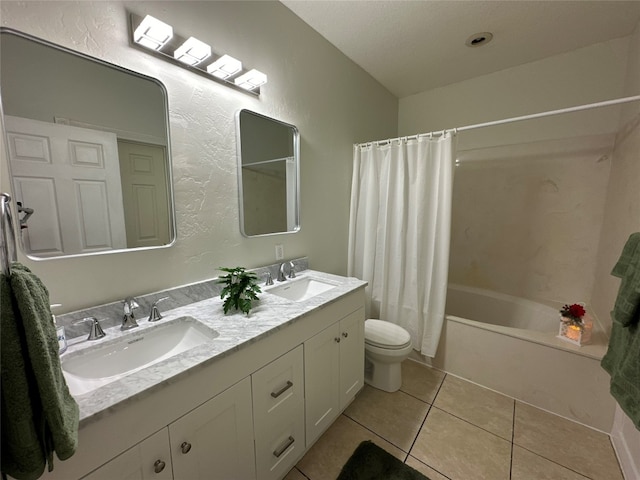 full bathroom featuring toilet, tile patterned flooring, vanity, and shower / tub combo