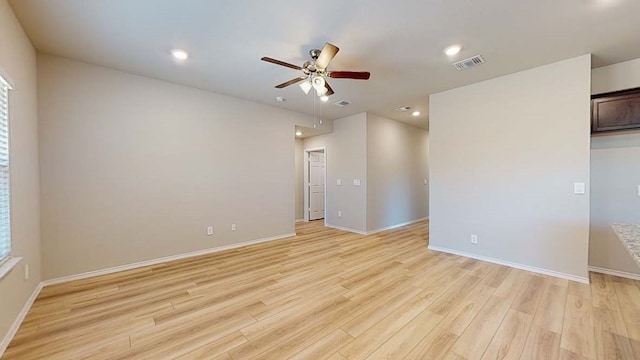 unfurnished room with ceiling fan and light hardwood / wood-style flooring