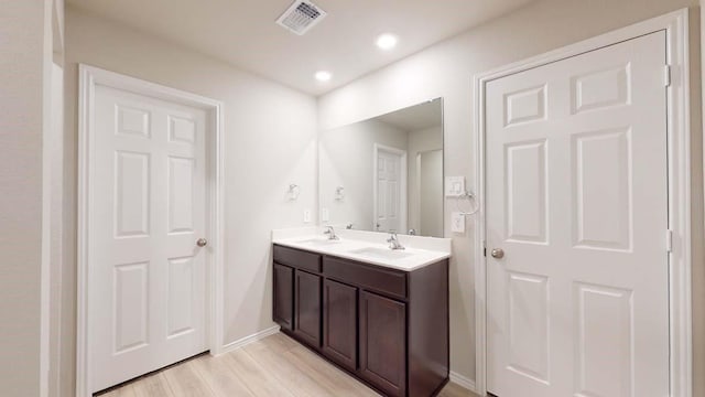 1330 Brookfield St, Temple, TX 76504 - full bathroom featuring double vanity, wood finished floors, baseboards, and recessed lighting