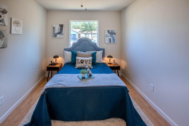 bedroom with light hardwood / wood-style floors