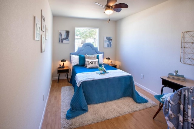 bedroom featuring ceiling fan and light wood-type flooring