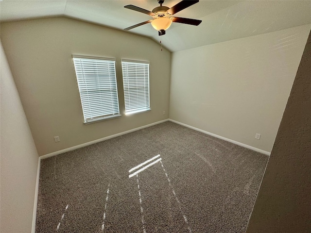 carpeted empty room with lofted ceiling and ceiling fan