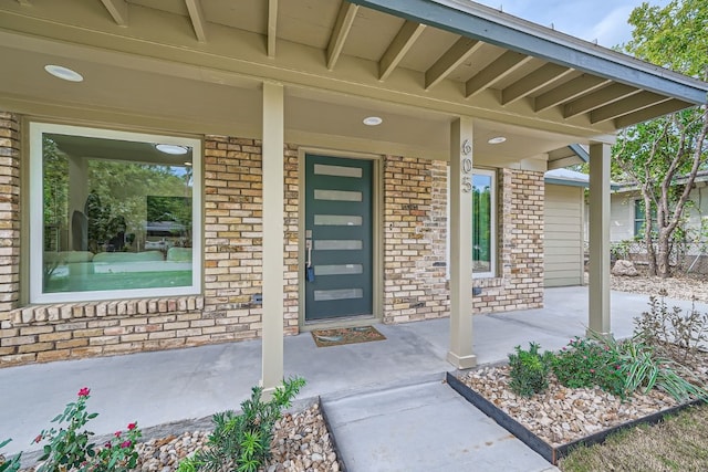 entrance to property featuring a porch