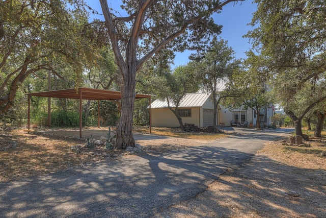 exterior space featuring a carport