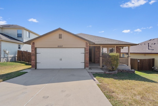 single story home featuring a garage and a front lawn