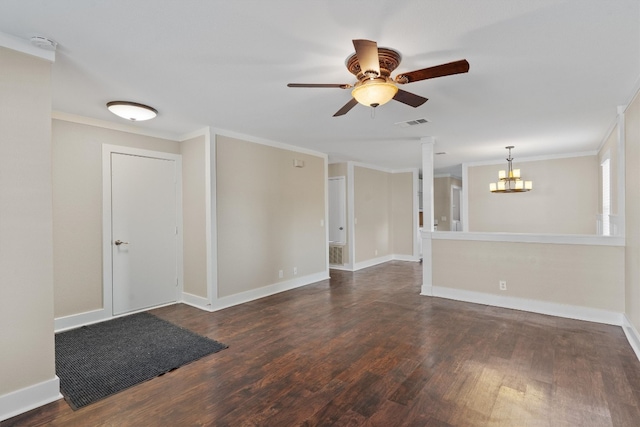 empty room featuring dark wood-type flooring, ornamental molding, and ceiling fan with notable chandelier