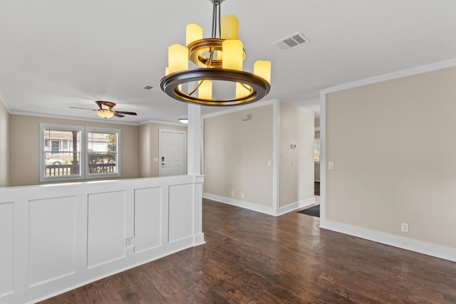 unfurnished room with dark wood-type flooring, crown molding, and ceiling fan with notable chandelier