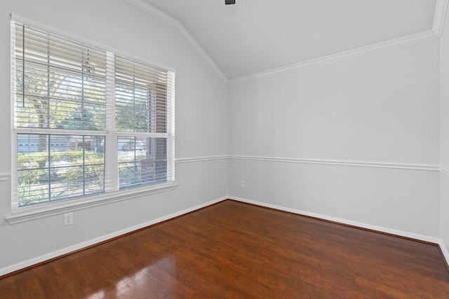 spare room featuring ornamental molding, hardwood / wood-style floors, and vaulted ceiling