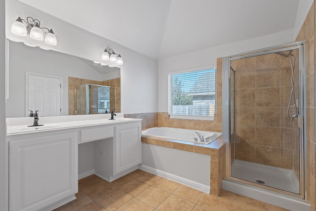 bathroom with tile patterned flooring, independent shower and bath, and vaulted ceiling