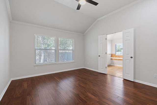 empty room with ceiling fan, ornamental molding, lofted ceiling, and dark hardwood / wood-style floors