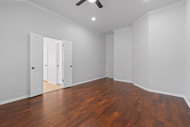 empty room with crown molding, dark hardwood / wood-style floors, and ceiling fan