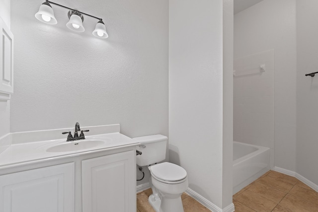 full bathroom featuring vanity, toilet,  shower combination, and tile patterned flooring