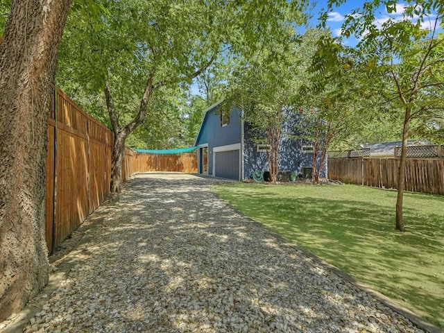 view of yard featuring a garage