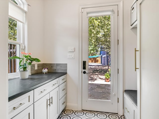 doorway to outside featuring a wealth of natural light