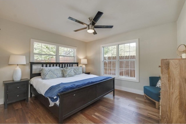 2200 Westover Rd, Austin, TX 78703 - bedroom with multiple windows, wood finished floors, baseboards, and a ceiling fan