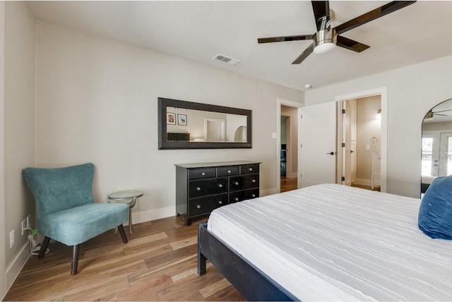 2200 Westover Rd, Austin, TX 78703 - bedroom with wood finished floors, baseboards, and ceiling fan