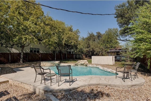 view of swimming pool featuring a patio area