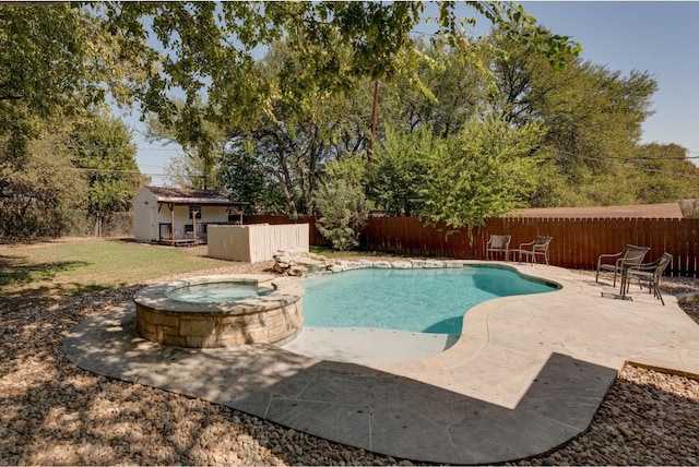 view of swimming pool featuring an in ground hot tub and a patio