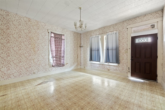 entryway with a notable chandelier