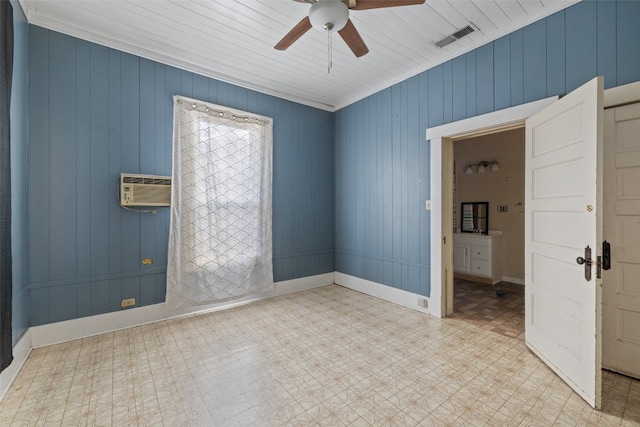 unfurnished room featuring wood walls, a wall mounted air conditioner, ceiling fan, wooden ceiling, and ornamental molding