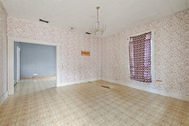 empty room with a chandelier