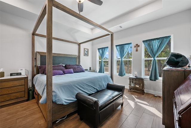 bedroom with hardwood / wood-style floors and ceiling fan