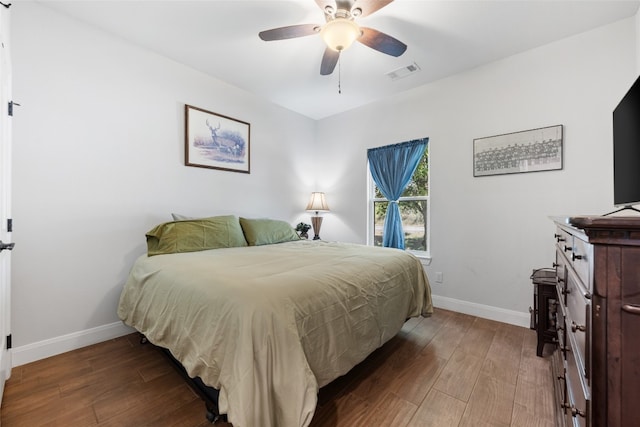 bedroom featuring dark wood-type flooring and ceiling fan