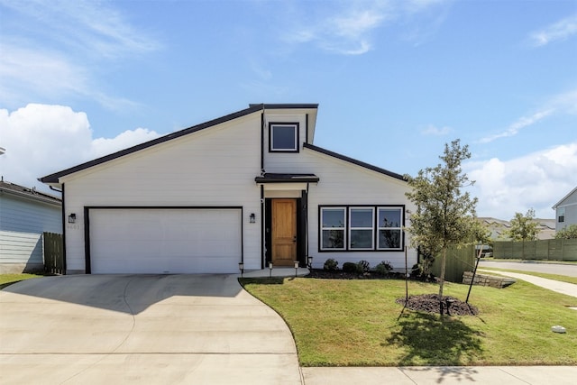 view of front facade featuring a garage and a front lawn