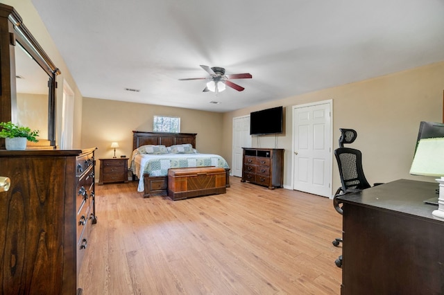 bedroom featuring light hardwood / wood-style floors and ceiling fan