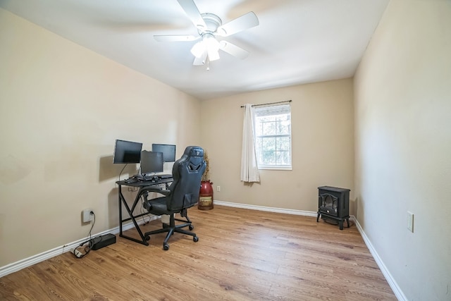 office with ceiling fan and light hardwood / wood-style flooring