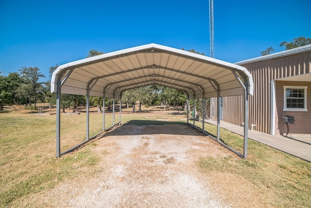 view of vehicle parking featuring a carport and a lawn