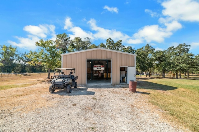 view of outbuilding with a yard