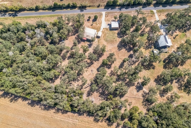 birds eye view of property with a rural view