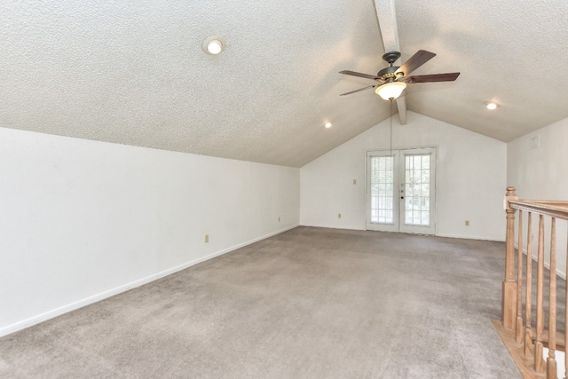 bonus room featuring ceiling fan, carpet floors, french doors, and vaulted ceiling