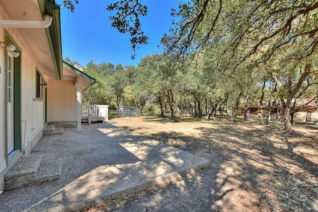 view of yard with a wooden deck