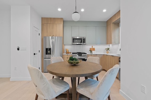 dining room with light wood-type flooring