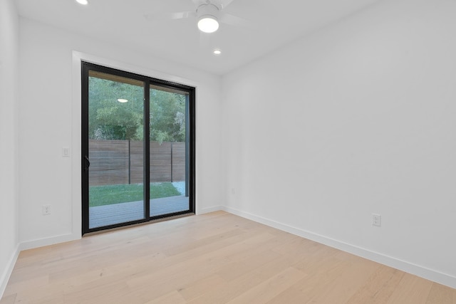 spare room with light hardwood / wood-style floors and ceiling fan