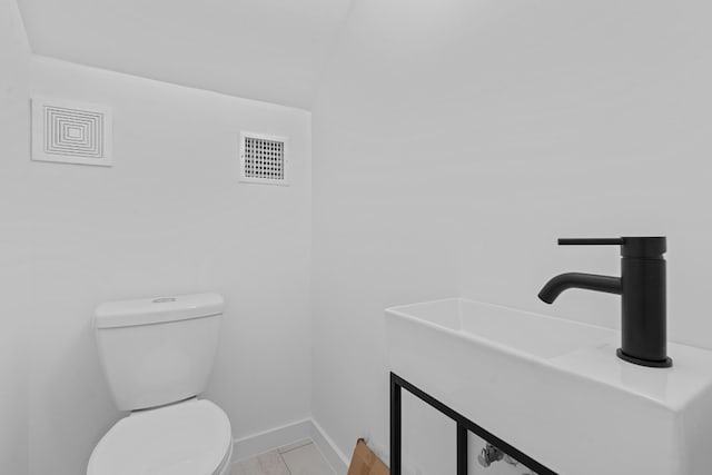 bathroom with toilet and sink