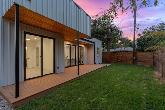 yard at dusk with a deck