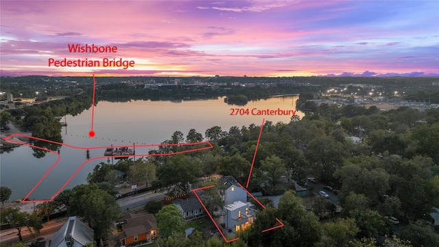 aerial view at dusk with a water view