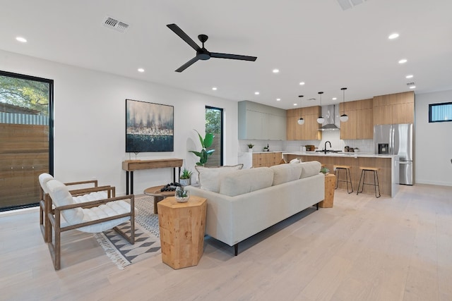 2704 Canterbury St Unit A, Austin, TX 78702 - living area with light wood-style floors, visible vents, and recessed lighting