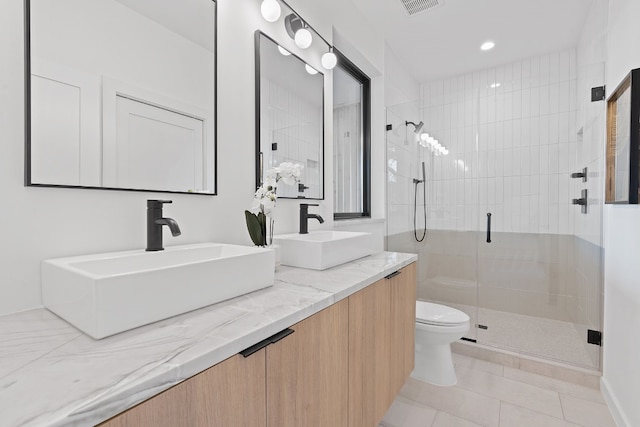 2704 Canterbury St Unit A, Austin, TX 78702 - full bath featuring a sink, tile patterned flooring, toilet, and a stall shower