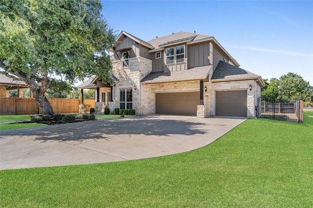 110 Magona Trl, Georgetown, TX 78628 - view of front of home featuring fence, a front yard, stone siding, roof with shingles, and concrete driveway